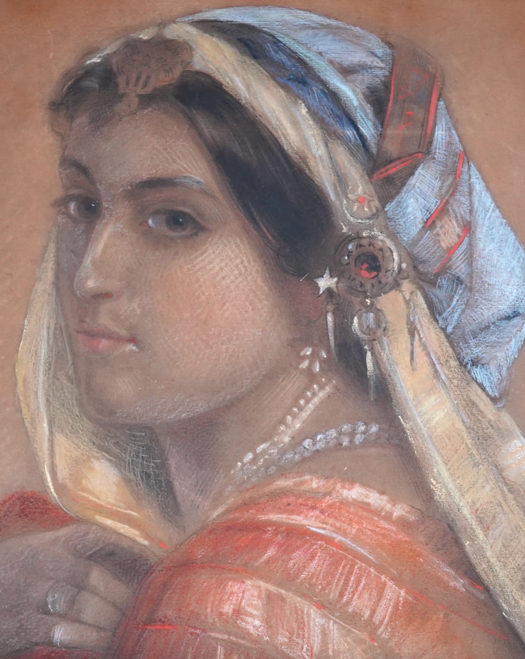 Orientalist School, pastel, Head and shoulders portrait of a woman, unsigned, mounted, 33 x 28cm, unframed. Condition - fair to good